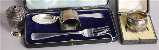 A cased George V silver christening trio, Walker & Hall, Sheffield, 1922/3, a silver napkin ring and plated condiment.